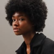 A picture of a woman with an afro